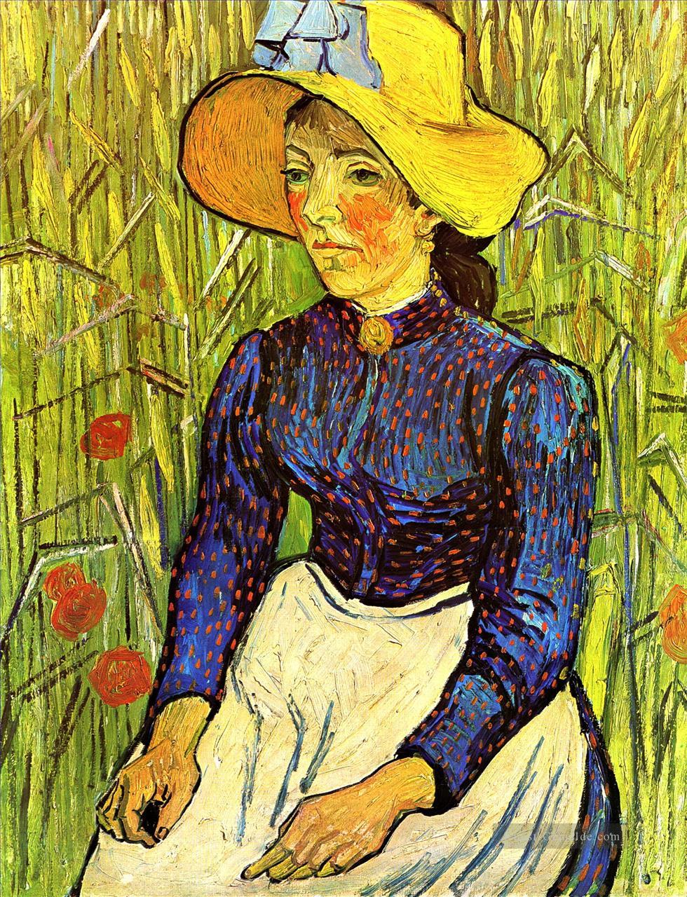 Junge Bäuerin in einem Strohhut sitzt vor einem Weizenfeld Vincent van Gogh Ölgemälde